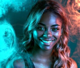 AI-generated abstract art of beautiful women gently enveloped in swirling translucent color mist, iridescent light shimmering on skin. By Jeff Dupler.