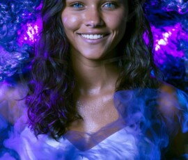 AI-generated abstract art of beautiful women gently enveloped in swirling translucent color mist, iridescent light shimmering on skin. By Jeff Dupler.