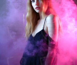 AI-generated abstract art of beautiful women gently enveloped in swirling translucent color mist, iridescent light shimmering on skin. By Jeff Dupler.