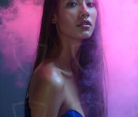 AI-generated abstract art of beautiful women gently enveloped in swirling translucent color mist, iridescent light shimmering on skin. By Jeff Dupler.