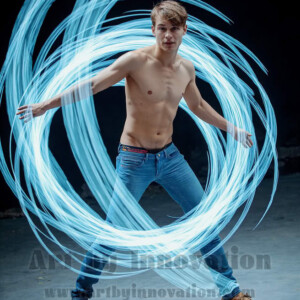 AI-generated abstract art of handsome shirtless men dancing with colorful dynamic light rays wrapping around their bodies. Cosmic, surreal, vivid digital art by Jeff Dupler.