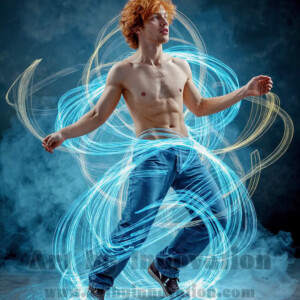 AI-generated abstract art of handsome shirtless men dancing with colorful dynamic light rays wrapping around their bodies. Cosmic, surreal, vivid digital art by Jeff Dupler.