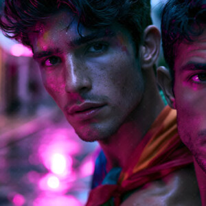 AI-generated Pride celebration art handsome men at vibrant LGBTQ+ Pride parades, embellished with rainbow colors, walking with pride, and celebrating love. By Jeff Dupler.