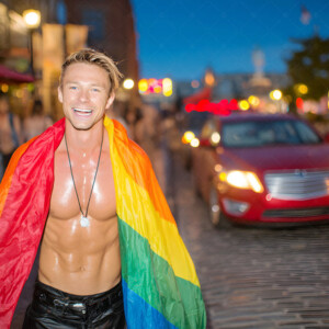 AI-generated Pride celebration art handsome men at vibrant LGBTQ+ Pride parades, embellished with rainbow colors, walking with pride, and celebrating love. By Jeff Dupler.
